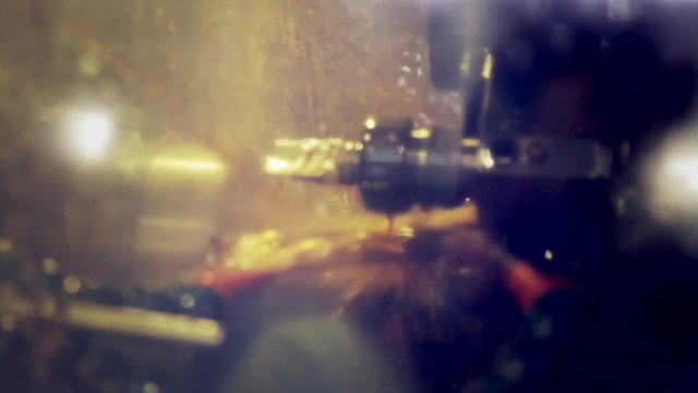 Process of turned parts in an automatic multi spindle lathe cooled with oil