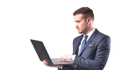 Handsome businessman with a laptop, isolated on white background