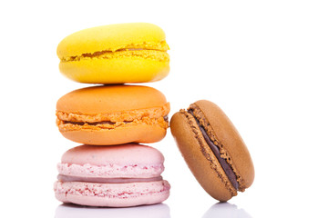 Pile of colorful macarons isolated on white background