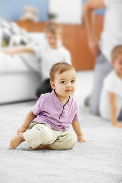 Adorable baby on the floor in the room