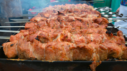 Appetizing kebabs on skewers cooked on the coals