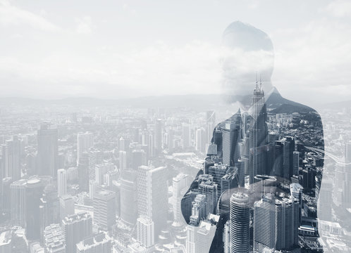 Photo of stylish adult businessman wearing trendy suit. Double exposure, panoramic view contemporary city background. Horizontal 
