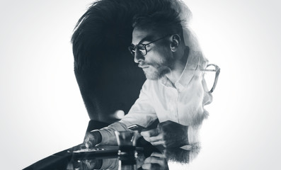 Portrait of stylish bearded lawyer wearing glasses and looking city. Double exposure, businessman working laptop at night, texting smartphone background. Isolated white. Horizontal, bw mockup - Powered by Adobe