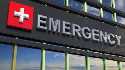 Emergency department building sign closeup, with sky reflecting in the glass.