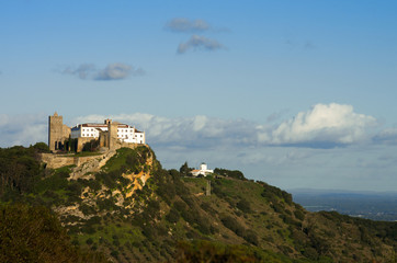 Fototapeta na wymiar Palmela castle on top of the hill, under blue sky. Portugal