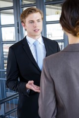 Businessman interacting with his business colleague