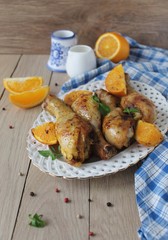 Roasted chicken legs in cast iron skillet, selective focus