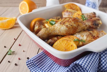 Roasted chicken legs in cast iron skillet, selective focus