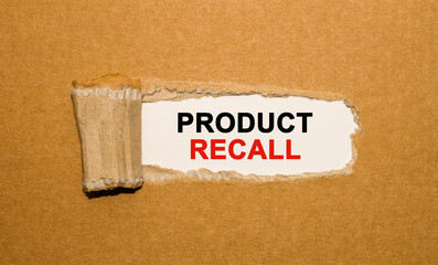The text Product Recall appearing behind torn brown paper