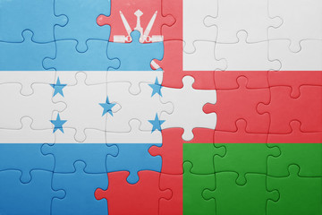 puzzle with the national flag of honduras and oman