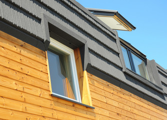 Modern Roofing Construction and Building New House with Skylights, Attic, Dormers and Roof Windows. 