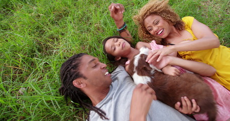 Top view shot of African-American family lying on their backs  - Powered by Adobe