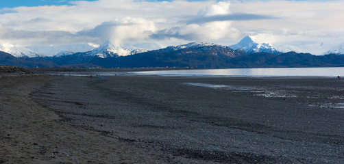 Gravel beach with buildings in the distance