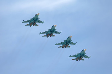 A group of military planes against a blue sky