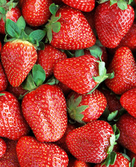 Red juicy strawberries closeup, background