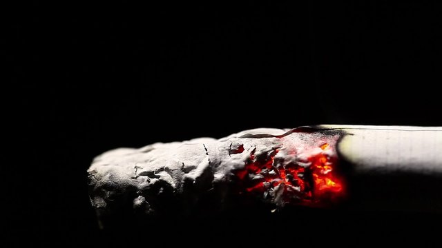 Close up footage of a burning cigarette.