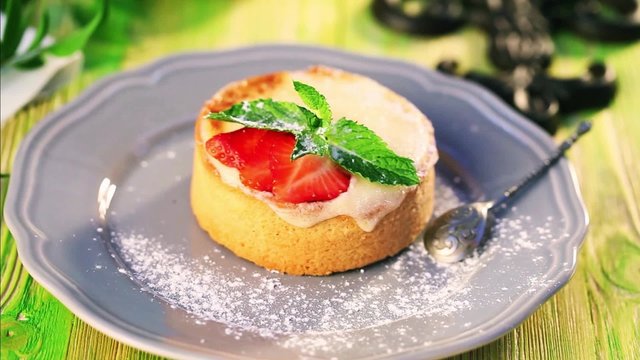 Motion, Food dessert food movement sprinkle with powdered sugar from semolina cake with strawberry and mint restaurant