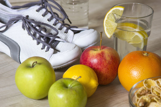 group of fruits and sneakers for weight loss