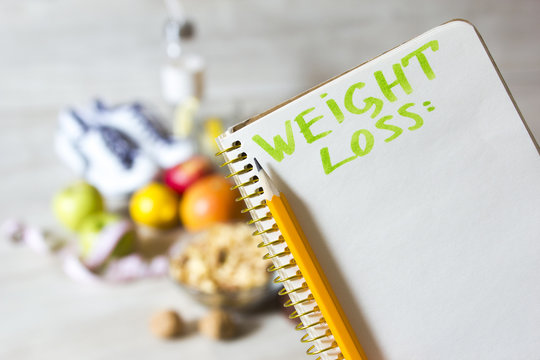 notebook for weight loss plan and healthy diet food