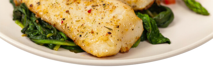 Baked white fish fillet on white background. Selective focus.