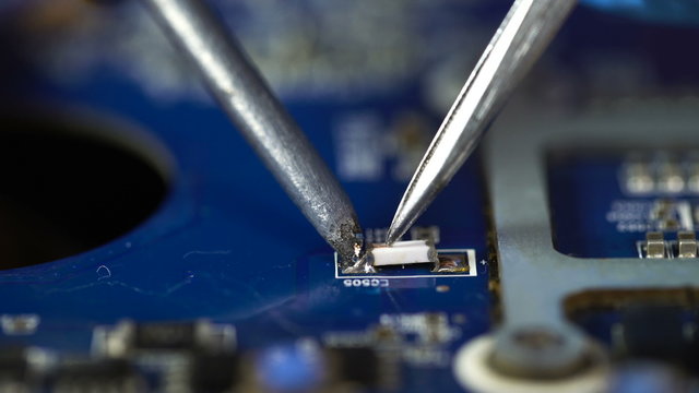 accuracy. soldering microchips and circuit boards