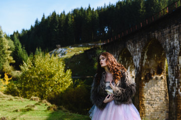 bride walks under a bridge