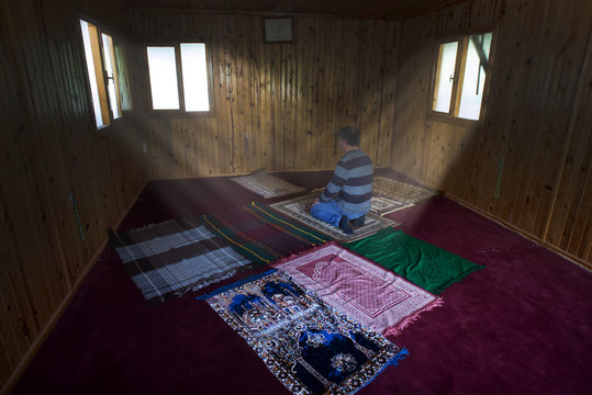 Muslim man praying in masjid