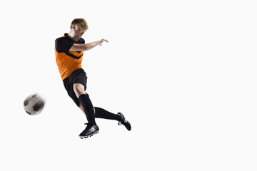 Fototapeta na wymiar Athlete kicking soccer ball