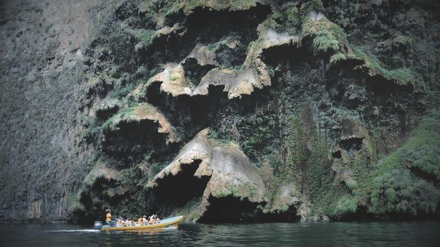 Touristic boat inside a narrow and deep canyon surrounded by a national park Sumidero Canyon, Chiapas, Mexico