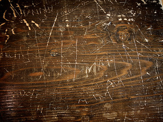 wood background dark wooden table with graffiti