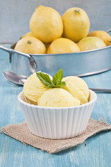 Lemon ice cream cup and lemons.
