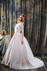 pretty bride in wedding dress and flowers in hair