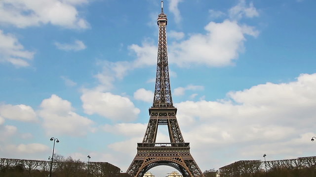 Eiffel Tower, Paris, France, Europe. View of the famous travel and tourism icon at daytime in spring with blue sky,