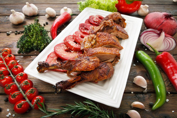 Roasted duck with apples and vegetables.