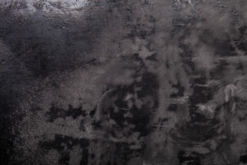 Flour spilling on black background