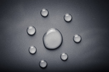 Dops of water on a color background. Gray. Toned