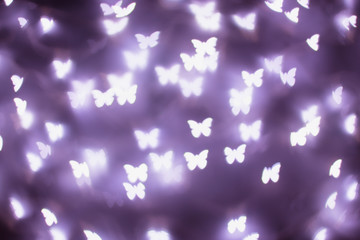 Purple butterfly bokeh lights. Bokeh defocused background © sevdastancheva