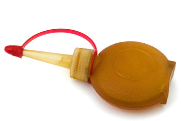 Old bottle of lubricating machine oil, isolated on white backgro