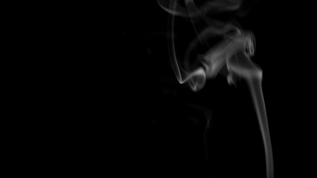 Footage white smoke on black background.