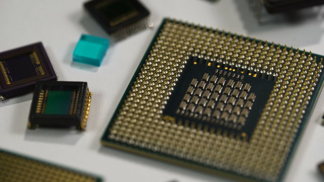 computer processor and electronic components on white background