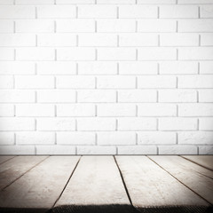 Room interior with brick wall and wooden floor