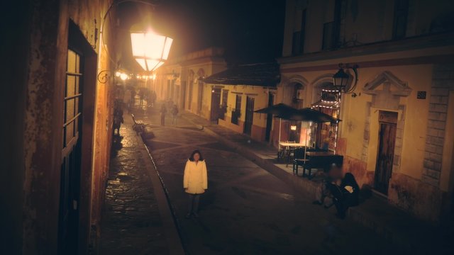 People walking at night on the main street of San Cristobal de las Casas, Chiapas. 4k