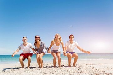 Company of young people on the beach