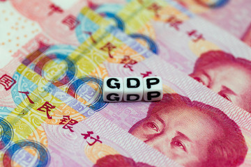 White cube blocks with the text, GDP, on Chinese currency