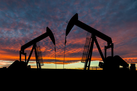 Dramatic Sky Over Pumpjack Silhouettes