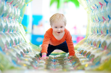 Toddler playing at indoors playground