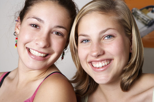 Caucasian teenage girls smiling together