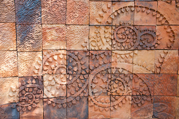 Brick wall with tree branches shape carved pattern