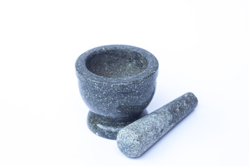 Stone mortar and pestle on white background