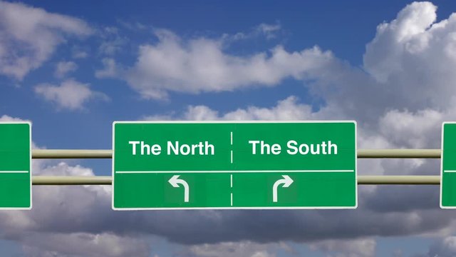Animation of traveling towards an overhead road sign of a road dividing in opposite directions to The North or to The South. Making a choice. The north south divide.